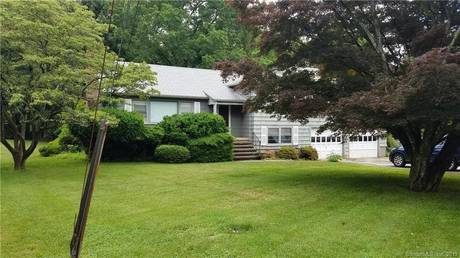 Single Family Home For Sale in Fairfield CT 06825. house near waterfront with 2 car garage.