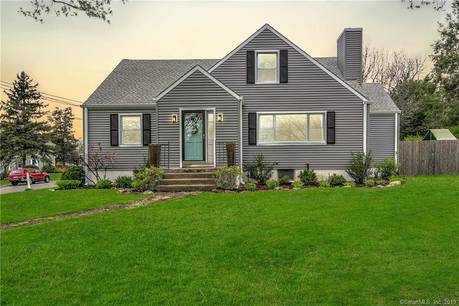 Single Family Home For Sale in Trumbull CT 06611. cape cod house near waterfront with 2 car garage.